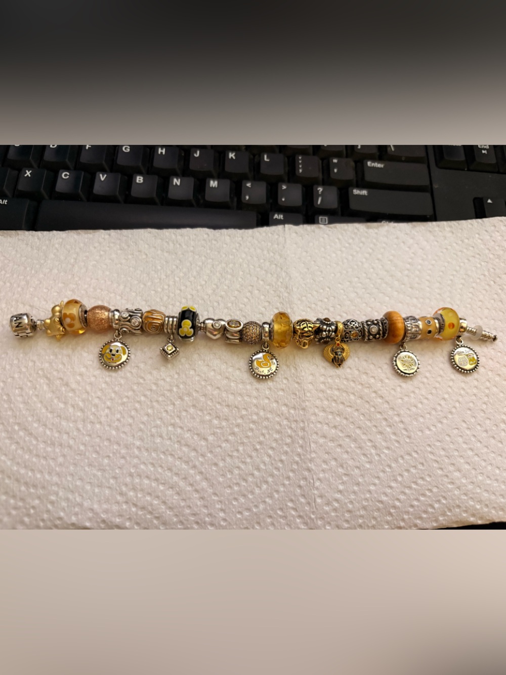 Pandora barrel clasp bracelet with yellow theme charms